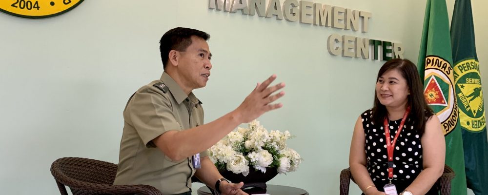 Lt. Col. Eliglen Villaflor discusses the situation of Army retirees to HR Group Manager Jaimie Natividad.